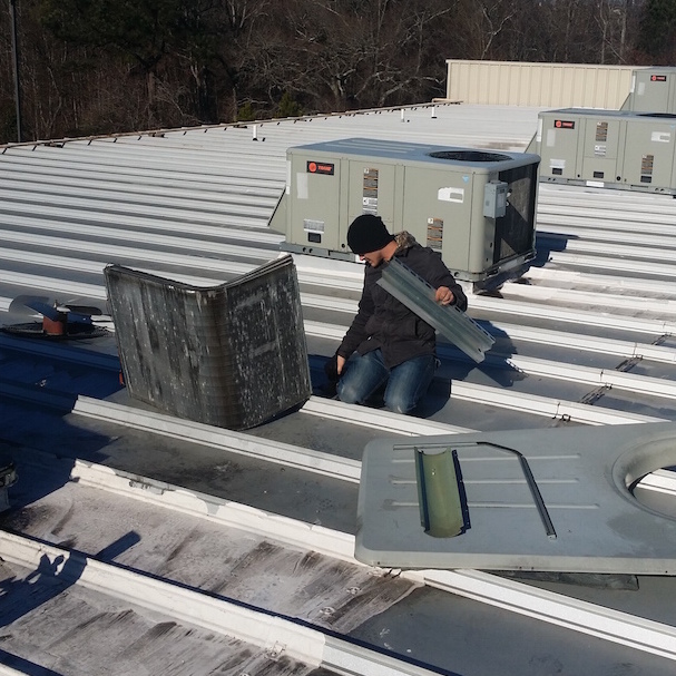 Man installing the AC